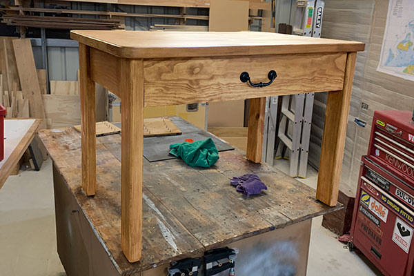 Wooden end table with storage drawer